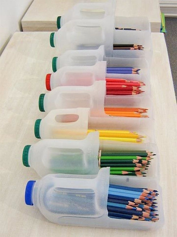 Recycled half-gallon milk jugs are perfect for storing colored pencils, markers, and other craft supplies.