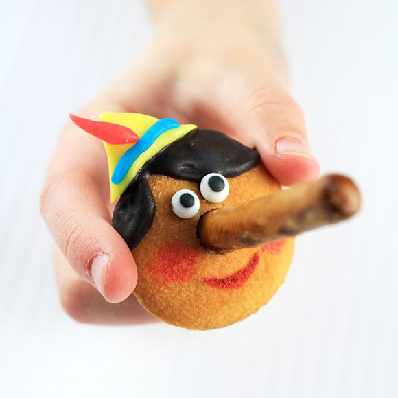 DIY Pinocchio Cookies with pretzel nose